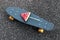 Closeup fashion grey skateboard with watermelon popsicle on the stick