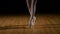 Closeup feet of a ballerina doing jumps in ballet dancer shoes