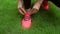 Closeup of feet of female runner getting ready tying running shoes, sneakers