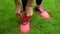 Closeup of feet of female runner getting ready tying running shoes, sneakers