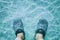 Closeup feet in the water
