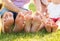 Closeup of feets lying in line at green grass