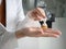 Closeup of a female doctor in a hospital waring white uniform is rubbing in palm use sanitizer alcohol gel washing hand to prevent