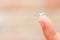 Closeup female finger with contact lens. Contact lenses on a finger