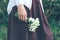 Closeup of female hand holding a bunch of snowdrops