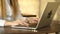 Closeup of a female hands busy typing on a laptop