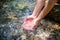 Closeup of female hands in the pure clear mountain waters