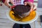 Closeup Of Female Hands Slice Cut Cake Bread, Christmas, Preparation Holiday And Party Season, Bokeh Food