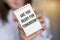 Closeup on Female holding a card with text ARE YOU READY FOR TOMORROW, business concept image with soft focus background and