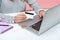 Closeup female holding credit card typing on laptop, bitcoin crypto coin lying on pc corner, withdrawal of electronic money to the