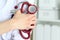 Closeup of female medicine therapeutist doctor standing with hands