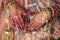 Closeup of a female showing mandalas on her hands during a traditional Indian wedding