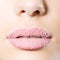 Closeup on female sweet candy sugar lips kiss