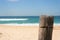 Closeup of fence post at surfing beach on sunny summers day