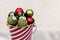 Closeup of Festive Small Balls Collected in Striped Bucket for C