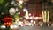 Closeup of Festively Decorated Outdoor Christmas tree with bright red balls on blurred sparkling fairy background