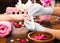 Closeup finger nail care by manicure specialist in beauty salon.