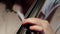 Closeup of fingers virtuoso musician playing classical melody on strings cello, front view. Musician plays stringed
