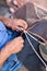 Closeup of fisherman repairing fishing net