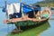 Closeup Fishing Boat with Fabric Roof on Sea Water