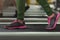Closeup of fitness woman legs walking on treadmill at gym