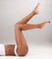 Closeup, fitness and woman with skincare, legs or epilation against a white studio background. Zoom, female person or