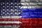 Closeup, flags of Usa against Russia on a cracked brick wall background. Concept of crisis of war and political