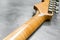 Closeup of flame maple headstock guitar