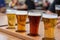 Closeup of a flight of cold beer on a restaurant table