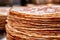 closeup of flour tortilla edges in a neat stack