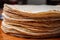 closeup of flour tortilla edges in a neat stack