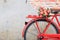 Closeup flower on saddle red bicycle classic vintage