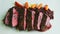 Closeup focus in at finely decorated barbecued sliced meat, rice, carrot