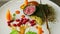 Closeup focus in at finely decorated modern restaurant meat dish with vegetables