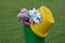 Closeup focus shot of a full dustbin at a park