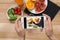 Closeup of food blogger photographing fresh fruits and vegetables with mobile phone
