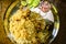 Closeup food photography of Handi Biryani, Asian traditional spicy rice meal served with Chicken, Mutton, Beef and vegetable salad