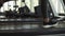 Closeup footage of woman`s feet in snakers running on a treadmill in fitness club. Blonde woman in grey leggings and