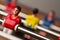 Closeup of football figurine on foosball table soccer game