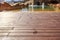 Closeup footprints on the wooden floor behind it swimming pool