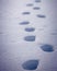 Closeup of footsteps in the snow