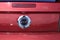 A closeup of a Ford GT Mustang brand on the trunk that`s red.