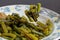 Closeup fork with fried green french bean