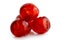 Closeup of four red glace cherries isolated on white.