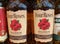 Closeup of four roses bourbon whiskey bottles in shelf of german supermarket