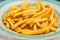 Closeup of frech fries on ceramic dish