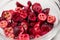 Closeup freeze-dried organic cranberry berries pieces in glass bowl natural food