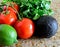 Closeup of fresh organic ingredients for salsa, avocado, tomato, lime, cilantro