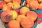 Closeup of Fresh Peaches in Baskets