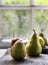 Closeup of fresh pears on wooden table
